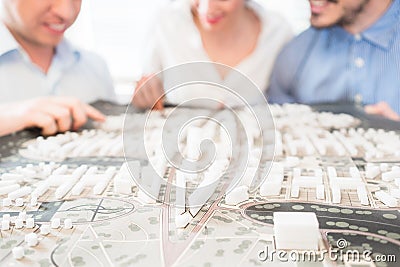 Architects with model for urban development Stock Photo