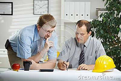 Architects talking at office Stock Photo