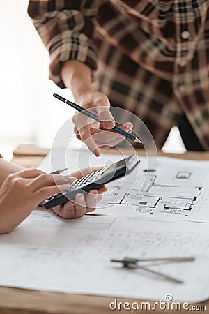 Architects talking at the table Teamwork and Workflow Creation Concepts, Close-up of Person Engineer& x27;s Hand Drawn Stock Photo