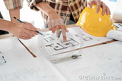 Architects talking at the table Teamwork and Workflow Creation Concepts, Close-up of Person Engineer& x27;s Hand Drawn Stock Photo
