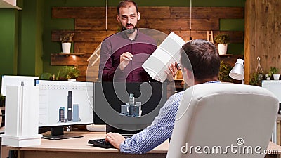 Architects team analyzing building maquette discussing architectural prototype structure Stock Photo