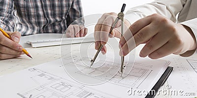 Architects working on blueprint, real estate project. Architect workplace - architectural project, blueprints, ruler Stock Photo