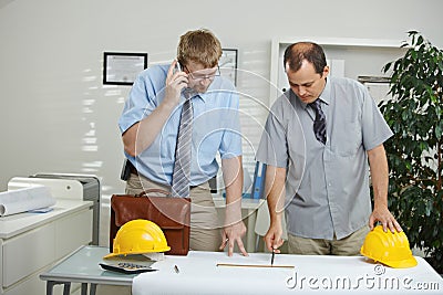 Architects working at desk Stock Photo