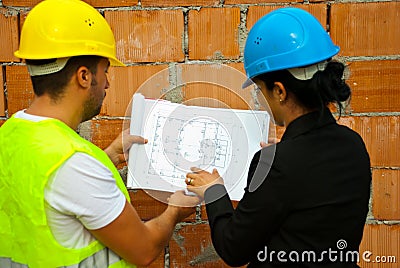 Architects working and looking on blueprints Stock Photo