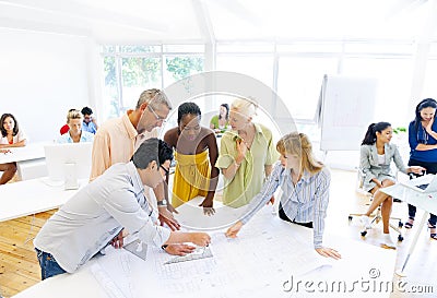 Architects Working on a Plan Stock Photo