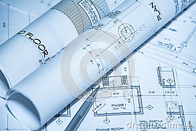 Architects workplace top view of blueprints. Architectural projects, blueprints, blueprint rolls on plans with pencil Stock Photo