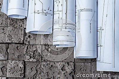 Architectural blueprints on grey wall backround Stock Photo