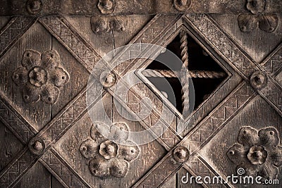 Architectural detail. Part decorative old wooden door with ornament Stock Photo