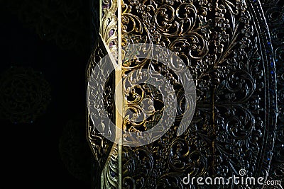 Architectural Details. Close-up detail shot of traditional Thai Art on the entrance door of blue temple in Chiang Rai Stock Photo