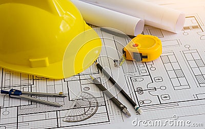 Architectural equipment and constuction hat on table Stock Photo