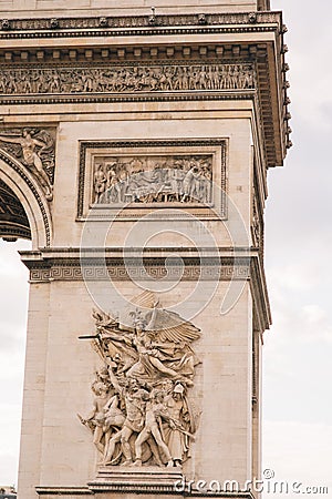 Architectural fragment of Arc de Triomphe. Arc de Triomphe de l\'Etoile on Charles de Gaulle Place is one of the most famous Stock Photo