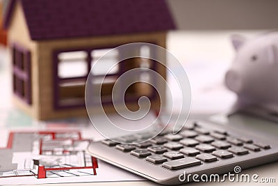 Architectural house plan house layout and calculator on table Stock Photo