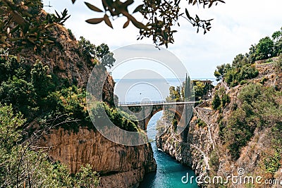 Architectural landmark, stone bridge. A view of the Fiordo of Furore in Amalfi coast, Travel and vacation concept. Summer day. Stock Photo