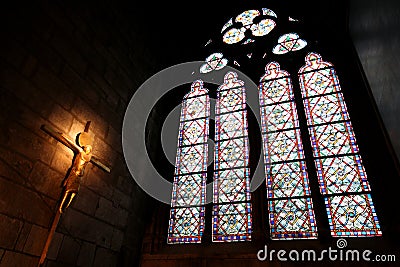 Stained Glasses and Statues under Sunlight with Notre Dame Cathedral Stock Photo