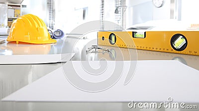 architectural office desk background construction project planning concept, with drawing equipment compass, helmet, spirit level Stock Photo