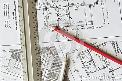 The architectural plan of the house is printed on a white sheet of paper. Editorial Stock Photo