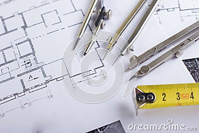 Architectural project, blueprints and divider compass on plans Engineering tools view from the top. Cop Stock Photo