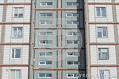 Architectural texture - multi-storey concrete panel apartment building lined with white tiles Stock Photo