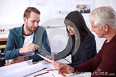 Architecture, blueprint and business people in meeting with paperwork, discussion and planning for building project Stock Photo