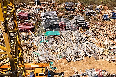 Architecture building and Construction site industry. A pile of iron materials stored on the construction site. Aerial view of a c Stock Photo