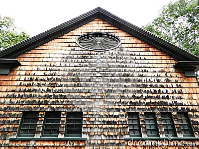 Architecture using cedar shake on historic NYS building Stock Photo