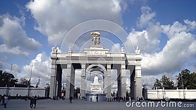 Architecture of Central entrance with colonnade to Park. Action. Tourists walking at architectural Central entrance to Editorial Stock Photo