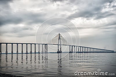 Architecture and design concept. Bridge over sea in manaus, brazil. Road passage over water on cloudy sky. Travel destination and Stock Photo