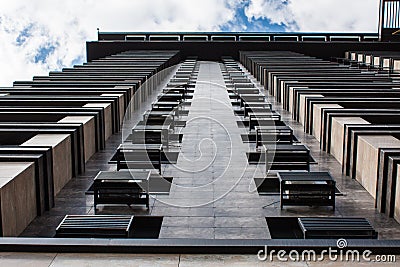 Architecture Detail, Modern Facade of Building. Underside panoramic and perspective view of skyscrapers high rising to the sky. Stock Photo