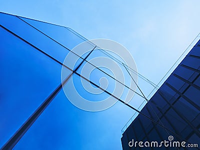 Modern Building Glass facade Blue reflection wall pattern Background Stock Photo
