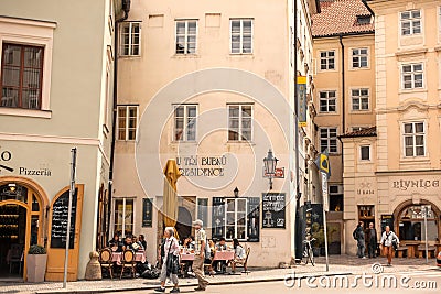 The architecture of the old city of Prague. Old cozy streets. Cafe with summer areas where people relax Editorial Stock Photo