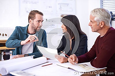 Architecture, planning and teamwork in meeting with paperwork, discussion and blueprint for building project. Civil Stock Photo