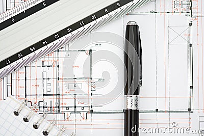 Architecture plans of a building with blueprints, ruler and notebook Stock Photo