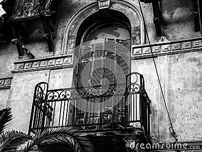 Architeture Details of Abandoned Hundred Years Old House, balconies in Black and White Stock Photo