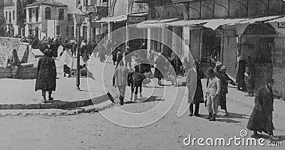 Archival monochrome photo taken in 1920 near Jaffa Gate in Jerusalem Palestine, now Israel. Photo shows buildings and people. Editorial Stock Photo