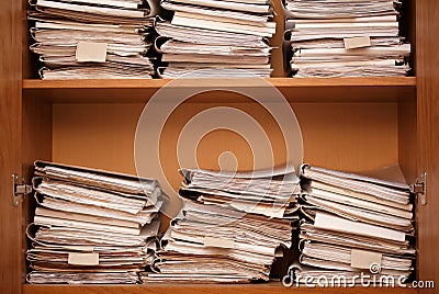 Archive. Wooden shelves with paper folders Stock Photo