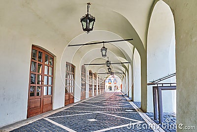 Archway passage at Arts House - Butchers Guild Hall Casa Artelor in Sibiu, Romania, with a pattern of wooden doors Stock Photo