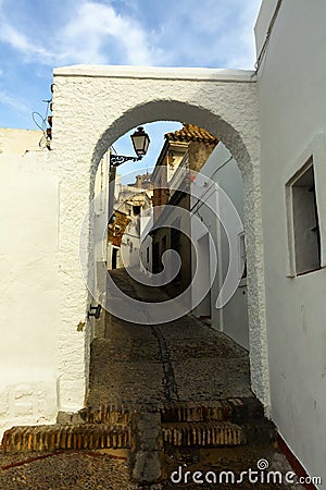 Archway at street of Arcos de la Frontera Stock Photo