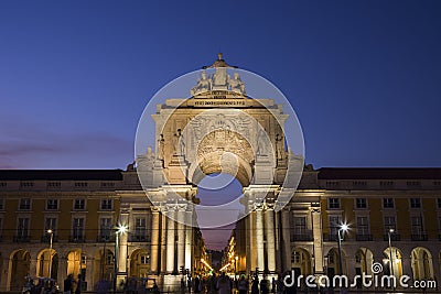 Arco da Rua Augusta and people at Praca do Comercio in Lisbon at dusk Editorial Stock Photo