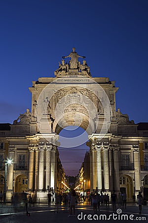 Arco da Rua Augusta and people at Praca do Comercio in Lisbon at dusk Editorial Stock Photo