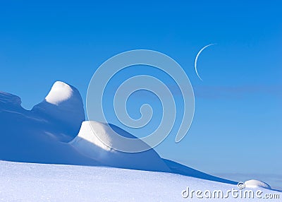 Arctic winter landscape, crescent moon in the blue sky Stock Photo