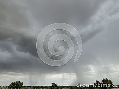 Arcus Cloud with Precipitation shafts Stock Photo