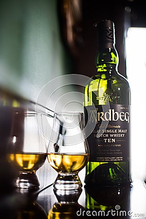 Ardbeg single malt whisky bottle and a Glencairn glass Editorial Stock Photo