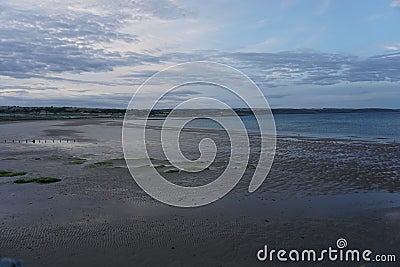 Ardmore beach in Ireland at sunset with no people Stock Photo