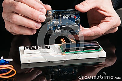 Arduino UNO board with electronic components Editorial Stock Photo