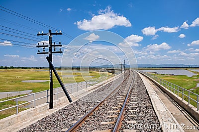 Area of Railroad tracks for travel train parked with floating railway bridge Stock Photo