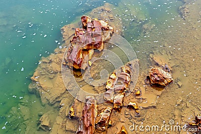 Colorful river rocks background in The river Odiel. Huelva, Andalucia, Spain Stock Photo