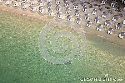 Areal view of sandy Koukounaries beach, turquoise sea, parasols and sunbeds Stock Photo