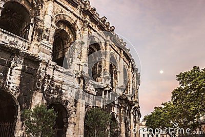 Arena of Nimes at sunrise and moonset Stock Photo