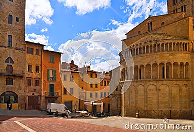 AREZZO, Cityscape with Piazza Grande square in Arezzo with facade of old historical buildings against cloudy blue sky , Tuscany, Editorial Stock Photo