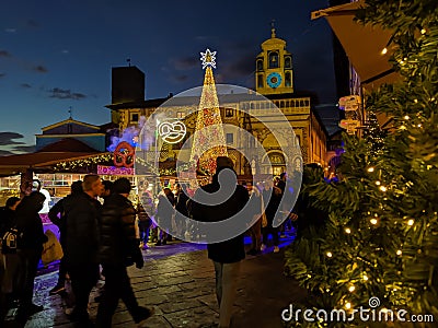 AREZZO, ITALY - NOVEMBER 26, 2022: View ot the main square of Arezzo called Piazza Grande with tyrolean christmas market in Tuscan Editorial Stock Photo